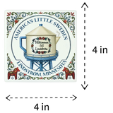Absorbent ceramic coaster featuring a tea-kettle-shaped water tower, rosemaling, two Dala horses, and the text Americas Little Sweden and Lindström, Minnesota.