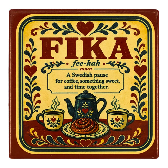 Square coaster featuring the word FIKA, a definition, a coffee pot, mugs, and a cinnamon bun, all decorated in traditional Swedish-style floral motifs.