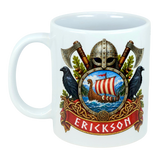 White mug with a Norse crest design showing a Viking helmet, crossed axes, ravens, a ship, and the name ERICKSON in bold red text.