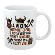 The Swedish Gift Store’s 11 oz “A Viking Without Coffee Irritable Person” ceramic mug features Viking helmet, axe, and vest illustrations—plus the witty saying: A Viking without coffee is just a very cold, highly irritable person in a fuzzy vest.