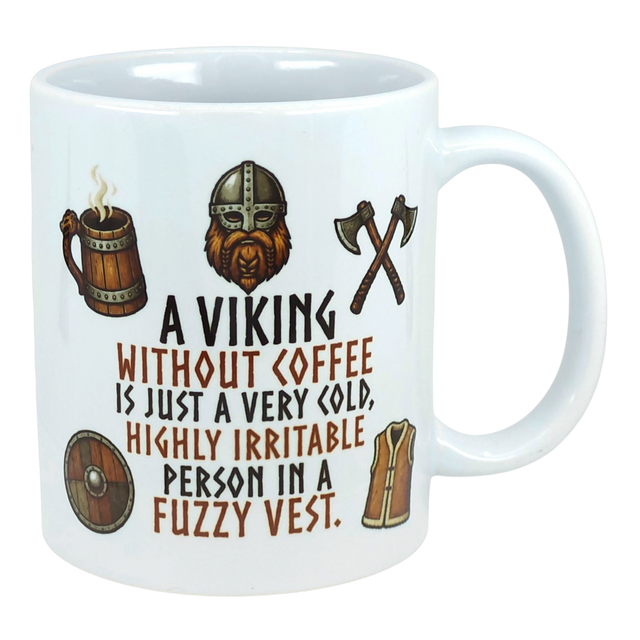 Ceramic mug with Nordic Viking art, featuring an axe and helmet illustration, and the text: “A Viking without coffee is just a cold, irritable person in a fuzzy vest.”.