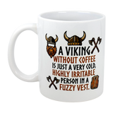 The Swedish Gift Store’s 11 oz “A Viking Without Coffee Irritable Person” ceramic mug showcases helmets, axes, and a vest with witty text—perfect for fans of Nordic humor!.