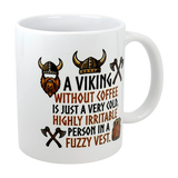 The Swedish Gift Store's 11 oz ceramic mug features Viking helmets, axes, and a vest. The mug reads: "A Viking without coffee is just a very cold, highly irritable person in a fuzzy vest.