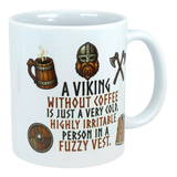 White ceramic mug featuring black text in a playful font: “A Viking without coffee is just a very cold, highly irritable person in a fuzzy vest.”.
