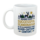 The Swedish Gift Store's 11 oz ceramic mug, “Behind Every Successful Scandinavian,” features a deer, trees, mountains, sun, and the phrase: Behind every successful Scandinavian is an alarmingly high blood-caffeine content.