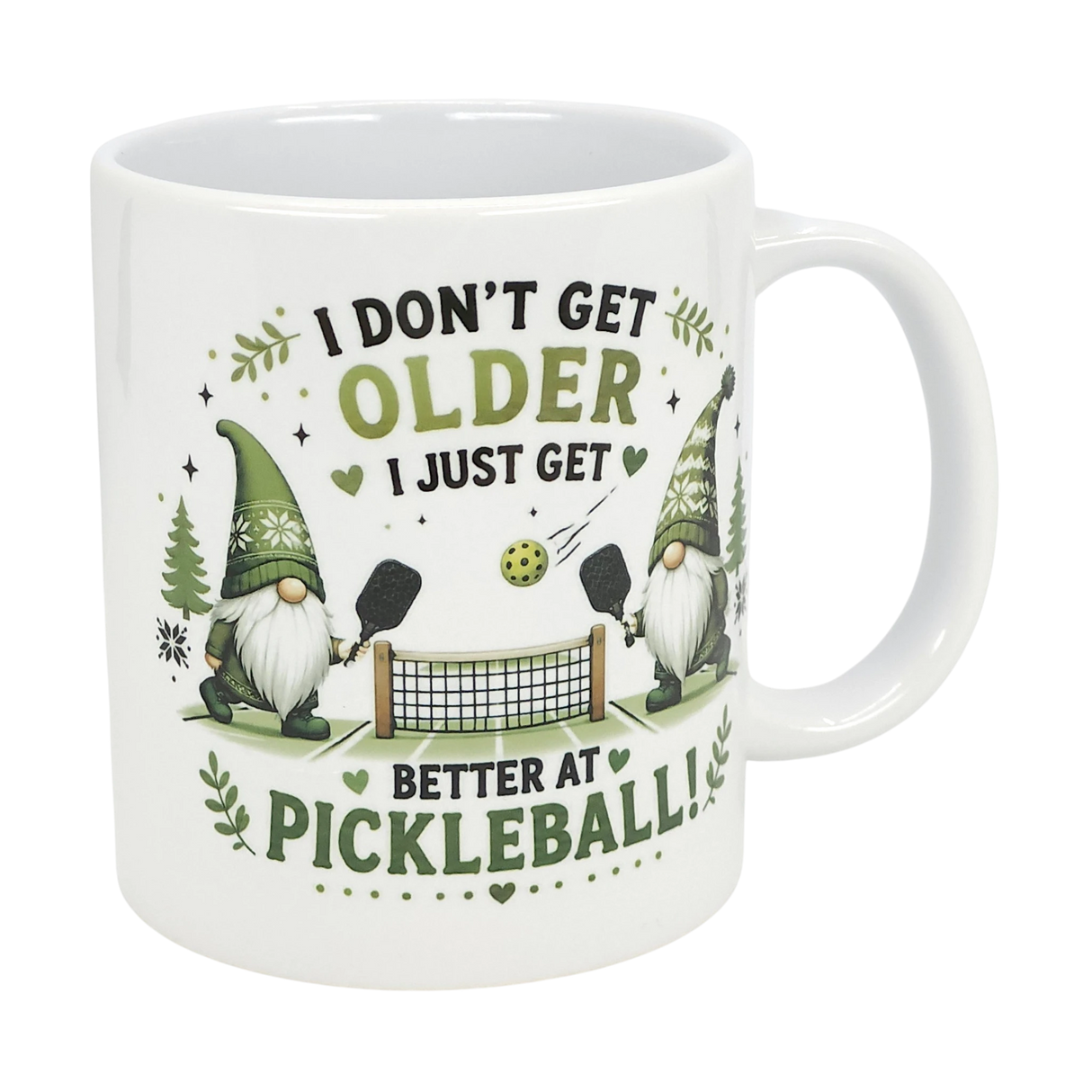 The Nordic Wholesale Mug: Better at Pickleball Ceramic Gnome Mug (11 oz) features two green-hatted Nordic gnomes playing pickleball, a net and ball, and the text: I don't get older, I just get better at pickleball!.