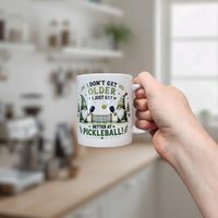 Mug: Better at Pickleball Ceramic Gnome Mug (11 oz Capacity)