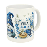 The Nordic Wholesale Mug: Blue Tomte Gnome Fika Ceramic Mug (11 oz) features a blue-and-white Scandinavian gnome with a heart mug, teacup, pastry, flowers, and FIKA sign—all in cozy Swedish coffee cup style.