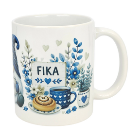 The Nordic Wholesale Mug: Blue Tomte Gnome Fika Ceramic Mug (11 oz) features blue and gray Scandinavian Tomte gnome designs with flowers, a cinnamon roll, coffee cup, and a “FIKA” sign surrounded by hearts and leaves.