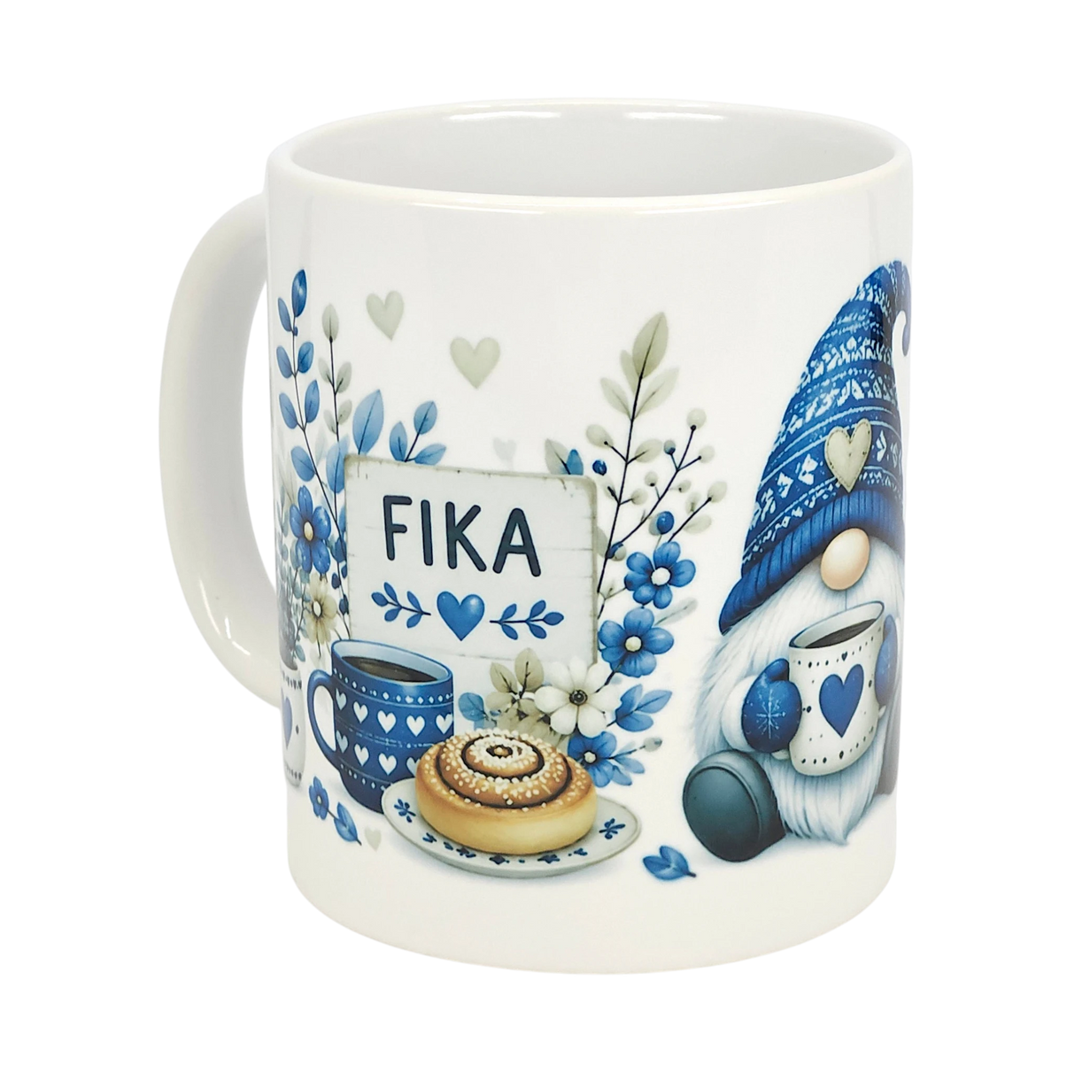 The Nordic Wholesale Mug: Blue Tomte Gnome Fika Ceramic Mug (11 oz) features a Scandinavian gnome in a knit hat with blue floral and heart accents, holding coffee and pastry near a FIKA sign.