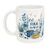 The Nordic Wholesale Mug: Blue Tomte Gnome Fika Ceramic Mug (11 oz) features a white Scandinavian gnome, blue flowers, coffee cup, cinnamon roll, and a "FIKA" sign with blue hearts.