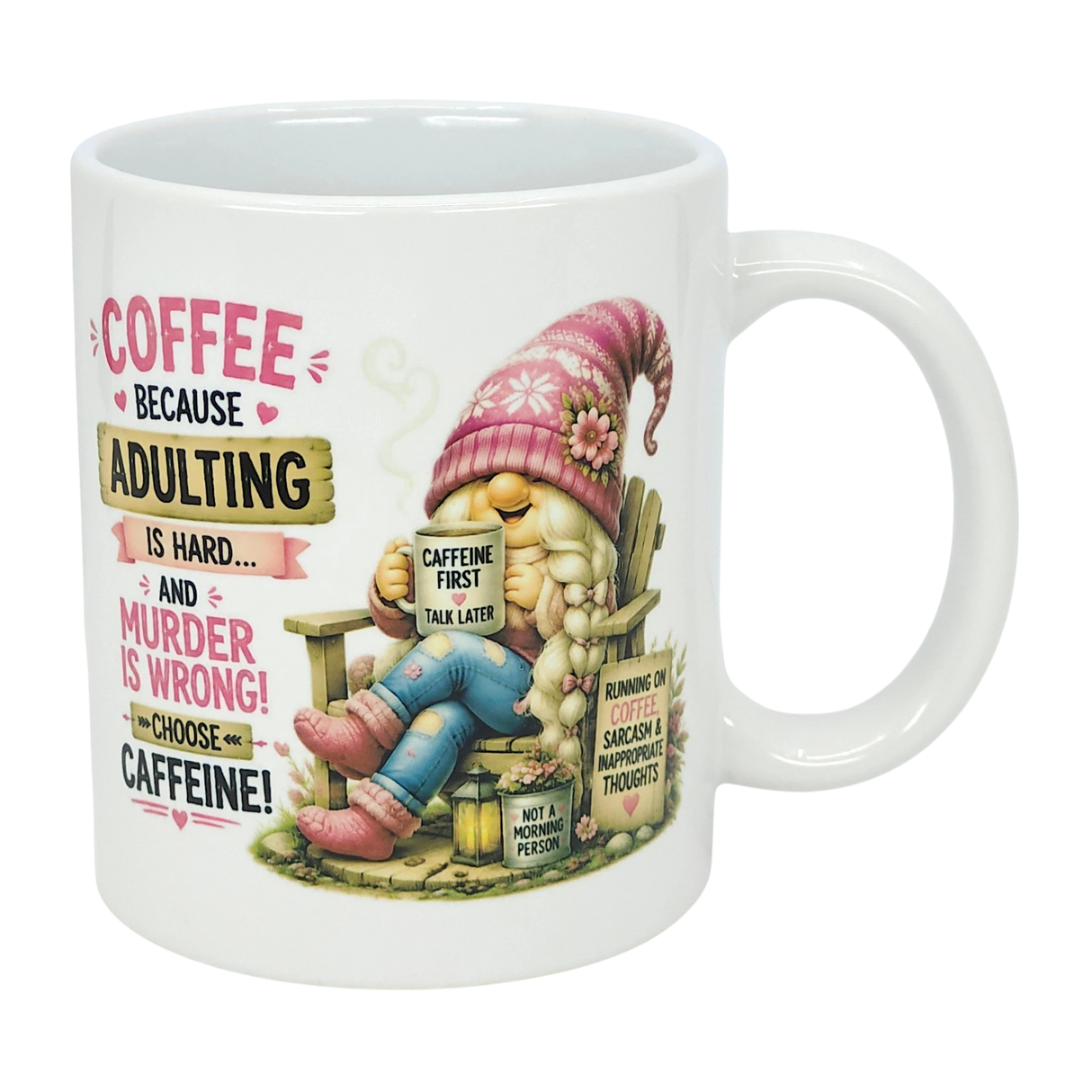 The Nordic Wholesale “Choose Caffeine Tomte” 11 oz ceramic mug features a Nordic gnome in a pink hat and boots, coffee in hand. The mug displays the text: “Coffee because adulting is hard… and murder is wrong! Choose caffeine!”.