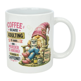 The Nordic Wholesale “Choose Caffeine Tomte” 11 oz ceramic mug features a Nordic gnome in a pink hat and boots, coffee in hand. The mug displays the text: “Coffee because adulting is hard… and murder is wrong! Choose caffeine!”.