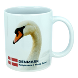 Elevate your kitchen with the Nordic Wholesale Mug: Denmark National Animal Mute Swan Ceramic Mug (11 oz), a white mug showcasing a graceful mute swan, the Danish flag, and the text "DENMARK Knopsvane | Mute Swan." This charming Scandinavian mug is a delightful way to honor Danish heritage in your home.