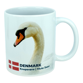 Elevate your kitchen with the Nordic Wholesale Mug: Denmark National Animal Mute Swan Ceramic Mug (11 oz), a white mug showcasing a graceful mute swan, the Danish flag, and the text "DENMARK Knopsvane | Mute Swan." This charming Scandinavian mug is a delightful way to honor Danish heritage in your home.
