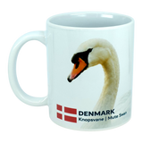 Introducing the Mug: Denmark National Animal Mute Swan Ceramic Mug (11 oz) by Nordic Wholesale—a white ceramic kitchen mug beautifully featuring the elegant mute swan, the Danish flag, and "DENMARK Knopsvane | Mute Swan" text on a crisp white background. This Scandinavian-inspired design celebrates both Denmark’s national animal and its rich heritage. Perfect as a unique addition to your mug collection—whether you love mute swans or Danish symbols!.