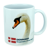 Bright white ceramic mug from Nordic Wholesale featuring the Denmark national animal, the Mute Swan, along with the Danish flag and “DENMARK Knopsvane | Mute Swan” printed below—an ideal 11 oz Scandinavian kitchen mug for bird enthusiasts or anyone looking for a classic Danish flag design.