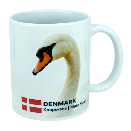 Bright white ceramic mug from Nordic Wholesale featuring the Denmark national animal, the Mute Swan, along with the Danish flag and “DENMARK Knopsvane | Mute Swan” printed below—an ideal 11 oz Scandinavian kitchen mug for bird enthusiasts or anyone looking for a classic Danish flag design.