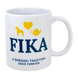 Introducing the Mug: Fika — A Swedish Tradition Since Forever Ceramic Mug (11 oz) by Nordic Wholesale. This white mug features "FIKA" in blue lettering, highlighted with a yellow heart, horse, and teapot above it. Beneath, it reads “A Swedish Tradition Since Forever.” Celebrate the warmth and timeless joy of Scandinavian coffee culture with this charming Fika mug—the perfect tribute to an enduring Swedish tradition.