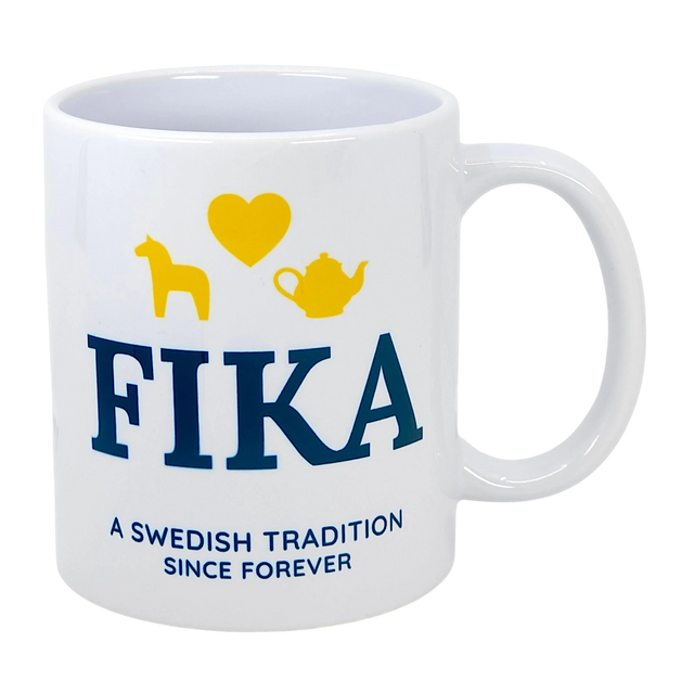 Introducing the Mug: Fika — A Swedish Tradition Since Forever Ceramic Mug (11 oz) by Nordic Wholesale. This white mug features "FIKA" in blue lettering, highlighted with a yellow heart, horse, and teapot above it. Beneath, it reads “A Swedish Tradition Since Forever.” Celebrate the warmth and timeless joy of Scandinavian coffee culture with this charming Fika mug—the perfect tribute to an enduring Swedish tradition.