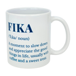 The Swedish Gift Store's White Ceramic Fika Definition Mug (11 oz) features blue text defining "FIKA"—a moment to slow down and savor the good things in life, often with coffee and a treat. Perfect for relaxing Swedish-style coffee breaks.