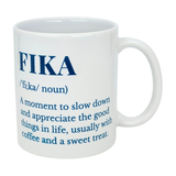 The Swedish Gift Store's White Ceramic Fika Definition Mug (11 oz) features blue text defining "FIKA"—a moment to slow down and savor the good things in life, often with coffee and a treat. Perfect for relaxing Swedish-style coffee breaks.