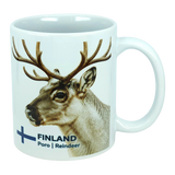 Discover the Nordic Wholesale Mug: Finland National Animal Reindeer Ceramic Mug (11 oz Capacity)—a white ceramic mug adorned with a delightful reindeer and antlers illustration. The text "FINLAND Poro | Reindeer" is displayed beside a blue cross, reminiscent of the Finnish flag. This charming mug is perfect for savoring your favorite drinks and adds a cozy touch of Lapland to any coffee break, making it an essential piece for fans of Scandinavian design and lovers of Finnish culture.
