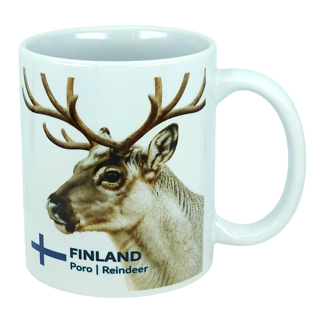 Discover the Nordic Wholesale Mug: Finland National Animal Reindeer Ceramic Mug (11 oz Capacity)—a white ceramic mug adorned with a delightful reindeer and antlers illustration. The text "FINLAND Poro | Reindeer" is displayed beside a blue cross, reminiscent of the Finnish flag. This charming mug is perfect for savoring your favorite drinks and adds a cozy touch of Lapland to any coffee break, making it an essential piece for fans of Scandinavian design and lovers of Finnish culture.