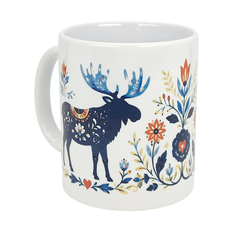 The Nordic Wholesale Mug: Folk Art Moose Ceramic Mug (11 oz) features a dark blue moose with floral accents, surrounded by vibrant Scandinavian folk art flowers and leaves in blue, red, and yellow.