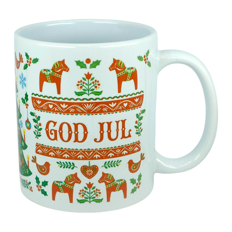 The Nordic Wholesale Mug: God Jul Dala Horse Christmas Ceramic Mug (11 oz Capacity) features Scandinavian folk art designs with red horses, hearts, and flowers. This charming mug displays the words "GOD JUL" in bold red letters at the center, surrounded by festive Nordic patterns.