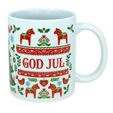 Celebrate Scandinavian traditions with the God Jul Dala Horse Christmas Ceramic Mug (11 oz Capacity) from Nordic Wholesale. This white ceramic mug features vibrant red and green Nordic folk art patterns, showcasing Dala horses, birds, trees, and "GOD JUL" in the center. It's the perfect coffee cup to add a festive touch to your holiday mornings or gift to lovers of charming Scandinavian decor.