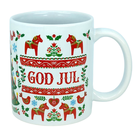 Celebrate Scandinavian traditions with the God Jul Dala Horse Christmas Ceramic Mug (11 oz Capacity) from Nordic Wholesale. This white ceramic mug features vibrant red and green Nordic folk art patterns, showcasing Dala horses, birds, trees, and "GOD JUL" in the center. It's the perfect coffee cup to add a festive touch to your holiday mornings or gift to lovers of charming Scandinavian decor.