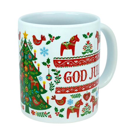 The Mug: God Jul Dala Horse Christmas Ceramic Mug (11 oz Capacity) by Nordic Wholesale is a white ceramic mug adorned with festive patterns, including a Christmas tree, red Dala horses, birds, and hearts. Featuring the Swedish phrase "God Jul" in red and surrounded by charming Nordic folk art designs, this coffee cup captures the warmth and cheerful spirit of Scandinavian holiday traditions.