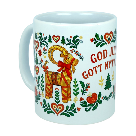 The Mug: God Jul Gott Nytt År Yule Goat Christmas Ceramic Mug (11 oz Capacity) from Nordic Wholesale is a white ceramic mug adorned with a straw Yule Goat, hearts, flowers, trees, and the Swedish greeting “God Jul & Gott Nytt År” in festive red. This charming Scandinavian holiday mug showcases traditional Nordic folk art designs—perfect from Nordic Wholesale for enjoying your favorite warm winter beverages.