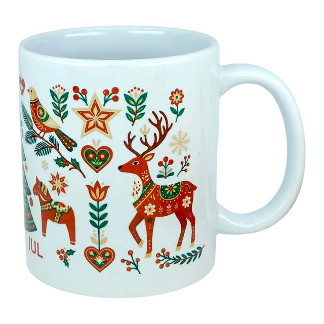 Experience festive Nordic tradition with the Mug: God Jul Nordic Folk Art Ceramic Mug (11 oz Capacity) by Nordic Wholesale, featuring a white Scandinavian design adorned with colorful folk art holiday motifs—reindeer, horses, birds, stars, hearts, and an array of flowers and branches in vibrant red, green, gold, and orange hues—a cheerful celebration of classic Scandinavian-style mug decor.