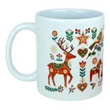 The God Jul Nordic Folk Art Ceramic Mug (11 oz Capacity) by Nordic Wholesale features charming Scandinavian folk designs in festive red, green, and yellow tones—including a reindeer, flowers, stars, and hearts. This vibrant mug beautifully captures the joyful spirit of a Nordic Christmas with its lively holiday motifs.