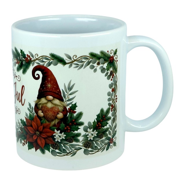 Celebrate the season with the Mug: God Jul Tomte Nordic Christmas Ceramic Mug (11 oz Capacity) from Nordic Wholesale. This white ceramic mug features a festive gnome holding a heart, surrounded by poinsettias, pinecones, holly, and greenery within a holiday-themed border. A charming Scandinavian design that brings a touch of Nordic cheer to your festivities.