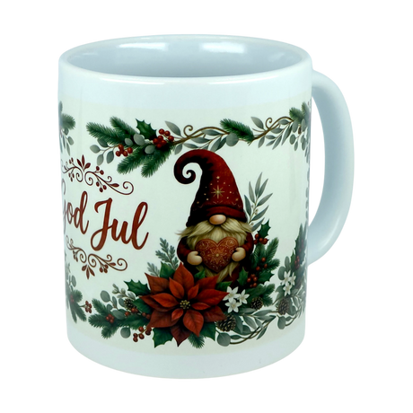 Bring festive cheer to your home with the Mug: God Jul Tomte Nordic Christmas Ceramic Mug (11 oz Capacity) by Nordic Wholesale. This charming Scandinavian-style mug features a Christmas gnome holding a heart, surrounded by holly, pine, and poinsettia, along with the traditional “God Jul” greeting—which means “Merry Christmas” in Swedish. It’s the perfect God Jul mug to celebrate the season!.