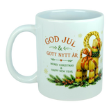 Celebrate the holidays with the Nordic Wholesale Mug: God Jul Yule Goat Ceramic Mug (11 oz Capacity), featuring a cheerful Swedish holiday greeting ("God Jul & Gott Nytt År") with English translation, festive greenery accents, and a decorative Swedish Julbock (straw Yule goat) on the side—a perfect classic Scandinavian mug for Yule Goat lovers this season.