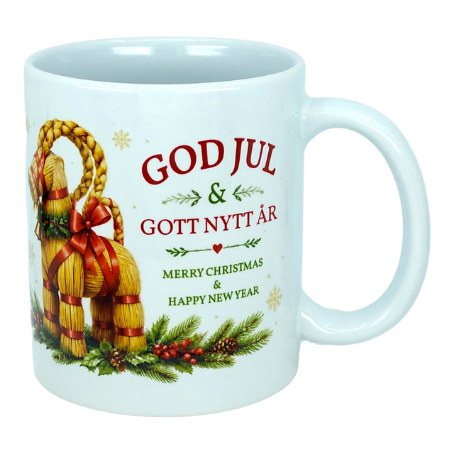 Introducing the Mug: God Jul Yule Goat Ceramic Mug (11 oz Capacity) by Nordic Wholesale—a white ceramic mug adorned with a charming Swedish Yule Goat, pine, and berries. Featuring festive text in red and green that reads: "GOD JUL & GOTT NYTT ÅR, Merry Christmas & Happy New Year," this Scandinavian Christmas mug is perfect for adding a touch of Nordic tradition to your holiday celebrations.