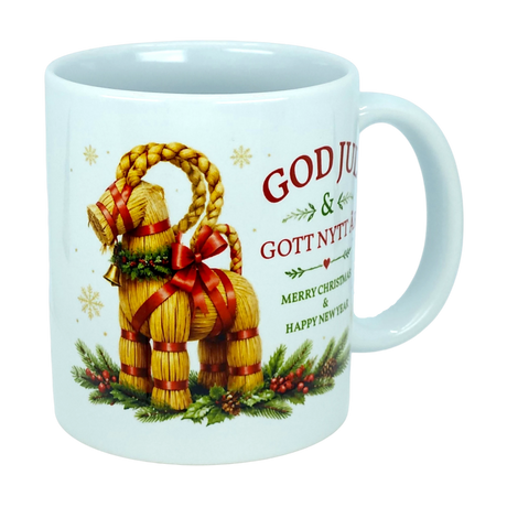 The Mug: God Jul Yule Goat Ceramic Mug (11 oz Capacity) by Nordic Wholesale features a charming image of a straw Yule goat adorned with a red ribbon, pine branches, and berries. The mug displays the text "God Jul & Gott Nytt År" alongside "Merry Christmas & Happy New Year." Perfect for bringing Swedish and Scandinavian Christmas tradition to your holiday celebrations.