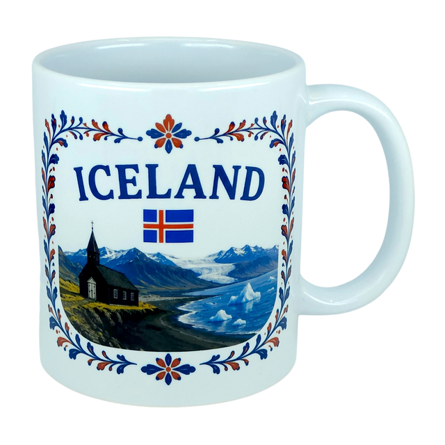 Introducing the Mug: Iceland Church Mountain Ceramic Mug (11 oz Capacity) by Nordic Wholesale. This white ceramic mug features "ICELAND," the Icelandic flag, and a picturesque scene of mountains, a church, water, and icebergs. A decorative blue and red floral border frames the Nordic landscape, making this mug an ideal gift for anyone celebrating their Icelandic heritage.