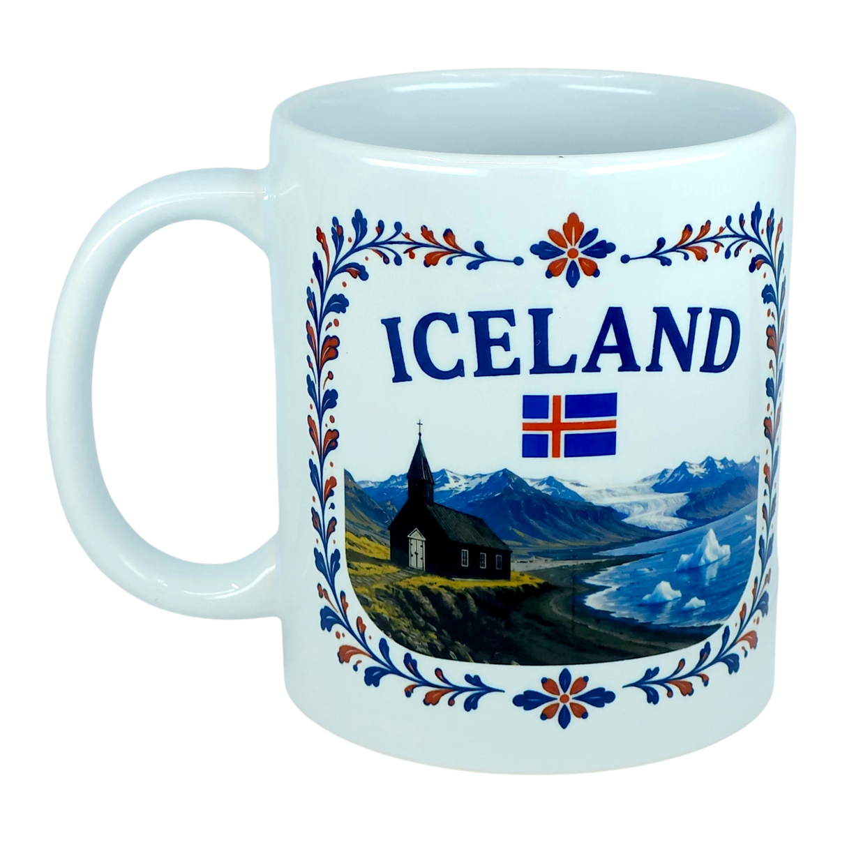 The Mug: Iceland Church Mountain Ceramic Mug (11 oz Capacity) by Nordic Wholesale features a white design adorned with the word "Iceland," the national flag, a scenic Nordic mountain landscape, a black church, and vibrant blue, orange, and red floral patterns around the rim—making it a perfect gift to celebrate Icelandic heritage.