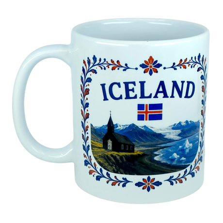 The Mug: Iceland Church Mountain Ceramic Mug (11 oz Capacity) by Nordic Wholesale features a white design adorned with the word "Iceland," the national flag, a scenic Nordic mountain landscape, a black church, and vibrant blue, orange, and red floral patterns around the rim—making it a perfect gift to celebrate Icelandic heritage.