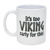 The Swedish Gift Store's 11 oz white ceramic mug, "It's Too Viking Early For This," features bold black text with "VIKING" in a wood-style font—a fun Norse-inspired mug perfect for your morning coffee.