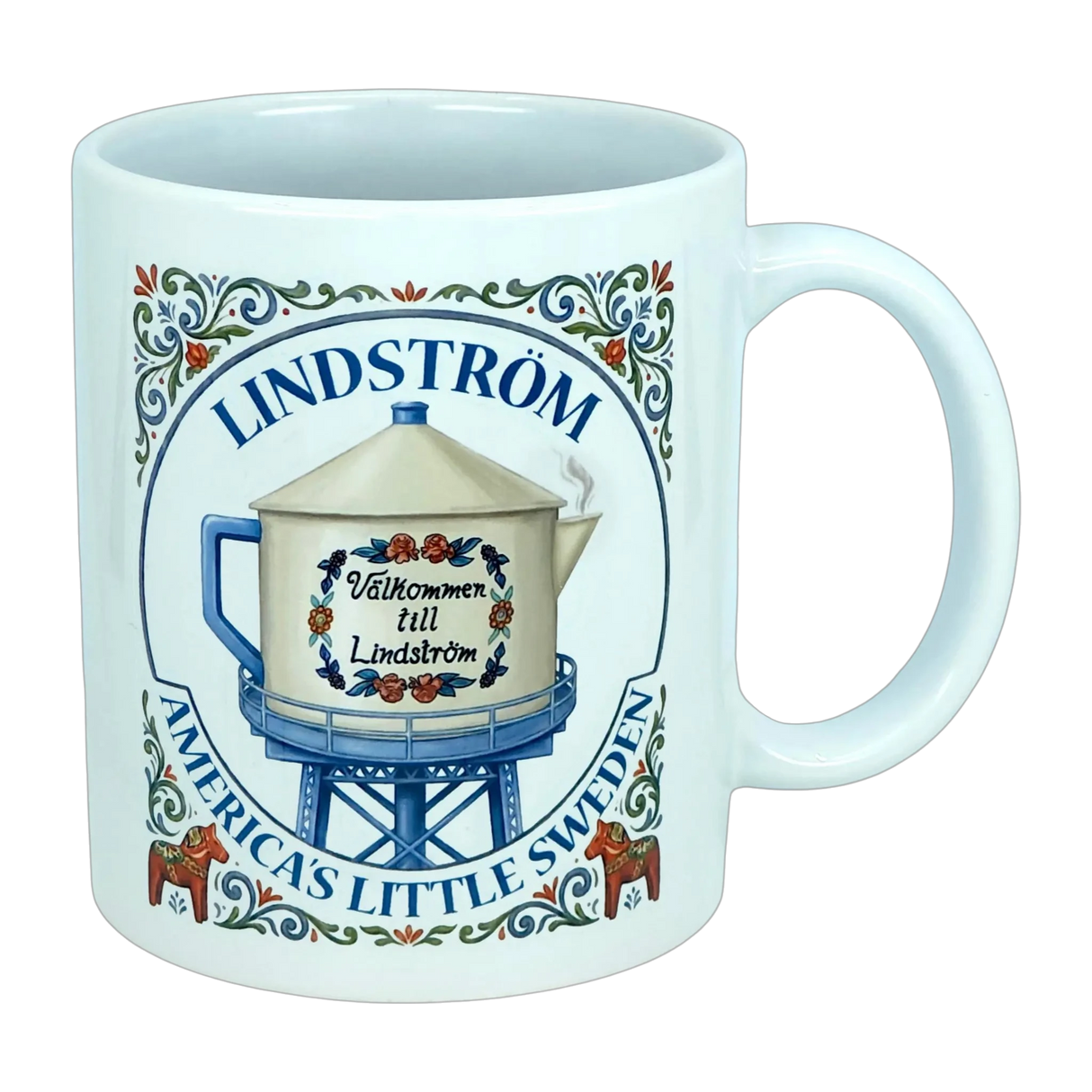 Introducing the Nordic Wholesale Mug: Lindstrom America's Little Sweden Ceramic Coffee Mug (11 oz)—featuring a charming decorative design with a water tower labeled "Välkommen till Lindström," surrounded by floral motifs inspired by Scandinavian folk art and the phrase "Lindstrom, America’s Little Sweden." A perfect mug for celebrating your Swedish heritage.