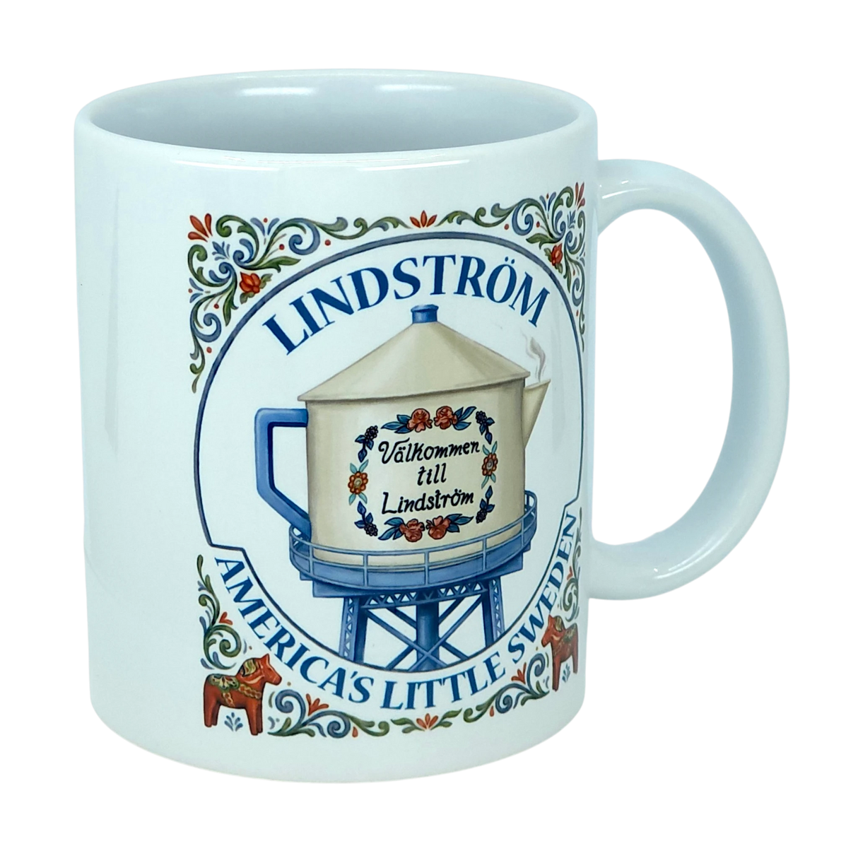 The Mug: Lindstrom America's Little Sweden Ceramic Coffee Mug (11 oz) by Nordic Wholesale features the phrase “Lindström: America's Little Sweden” and an illustration of a water tower labeled “Välkommen till Lindström,” all beautifully accented with Scandinavian folk art floral designs and traditional red Dala horses—a charming Swedish heritage piece for any mug collection.
