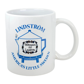 The Swedish Gift Store's 11 oz ceramic mug features Lindstrom’s iconic blue coffee pot water tower and “America’s Little Sweden” text—a perfect Chisago Lakes souvenir.