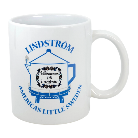 The Nordic Wholesale Mug: Lindstrom Coffee Pot Water Tower America's Little Sweden Ceramic Mug (11 oz) features blue text and a tower illustration, making it a perfect Chisago Lakes souvenir for honoring Swedish heritage.