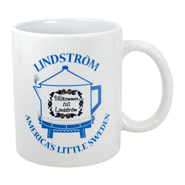 The Swedish Gift Store's 11 oz ceramic mug features Lindstrom’s iconic blue coffee pot water tower and “America’s Little Sweden” text—a perfect Chisago Lakes souvenir.
